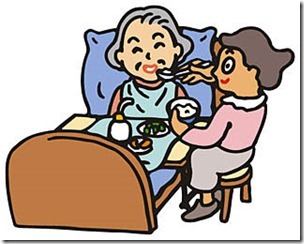 介護を受けながら食事をする高齢者